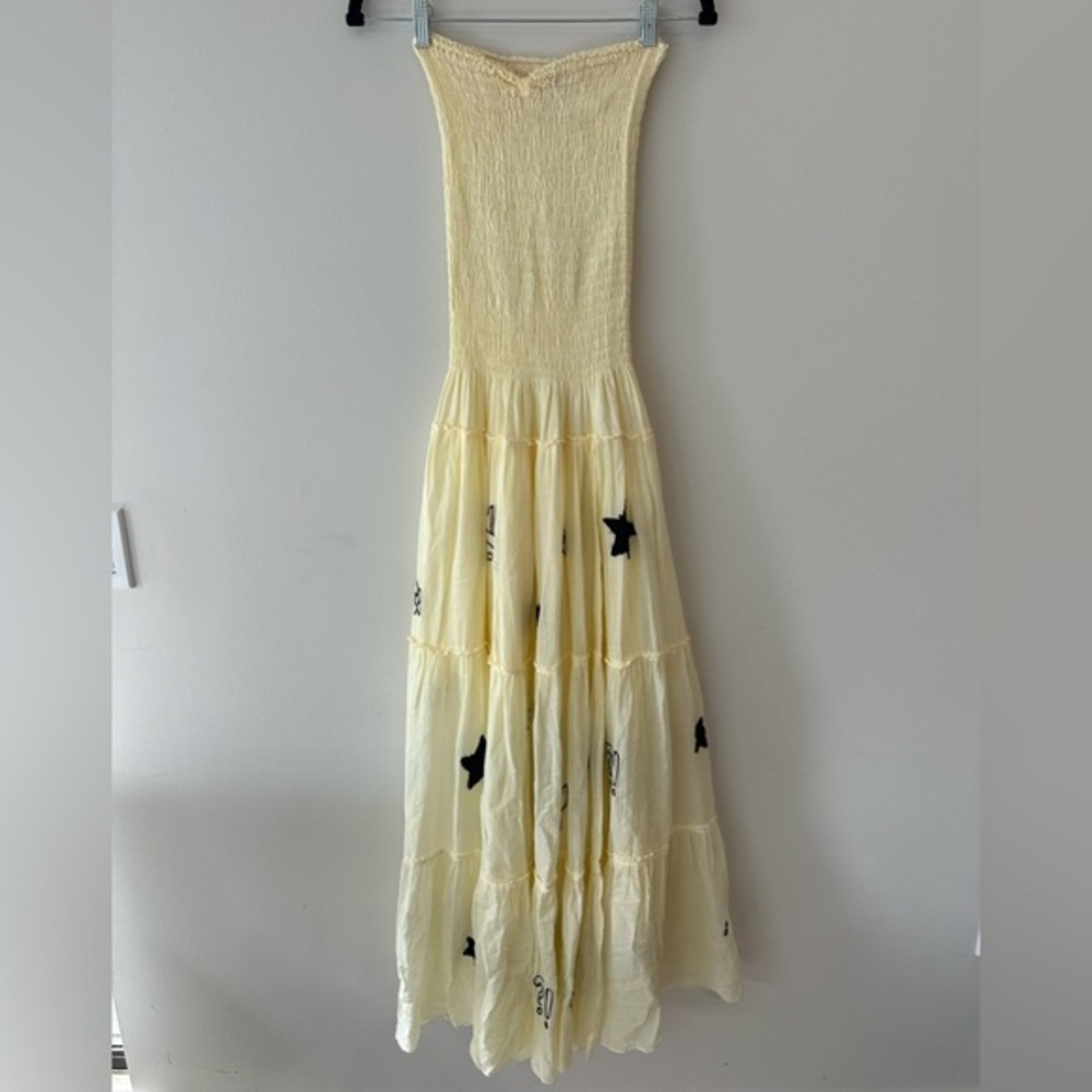 Chic Yellow Strapless Maxi Dress with Black Star Accents